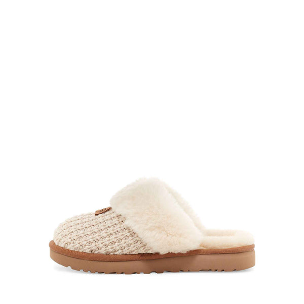 Beige slipper with brown sole on a white background