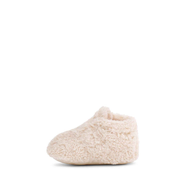 Beige baby bootie on a white background
