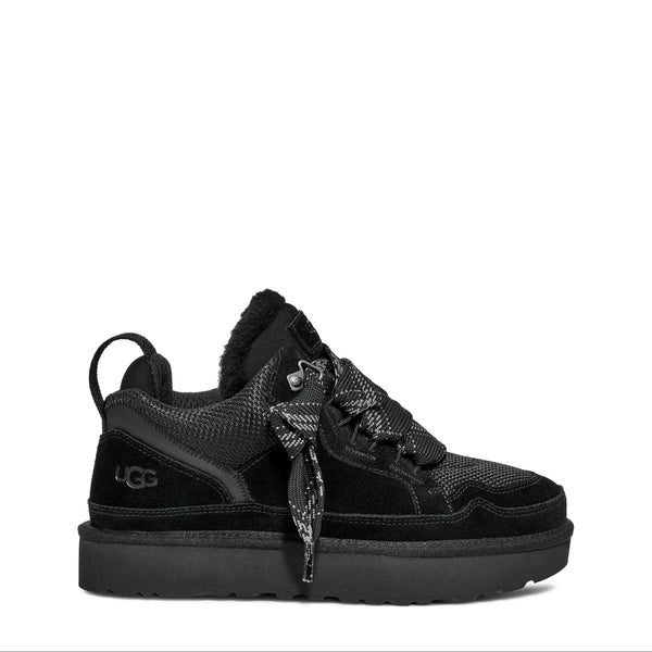 Black sneaker with a platform sole on a white background