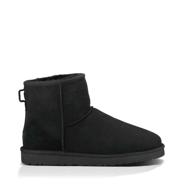 Black suede ankle boot on a white background