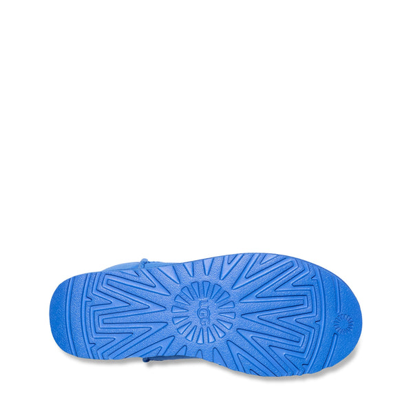 Blue shoe sole with intricate pattern on a white background.