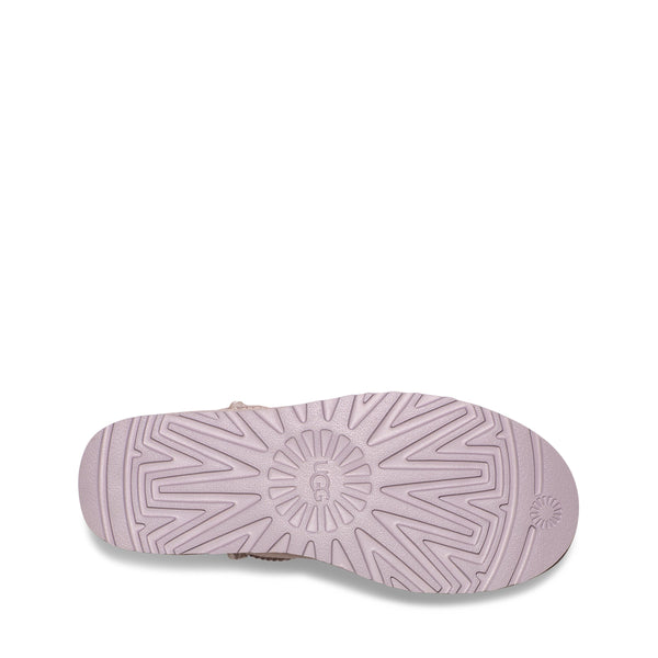 Sole of a shoe with intricate tread pattern, white background.