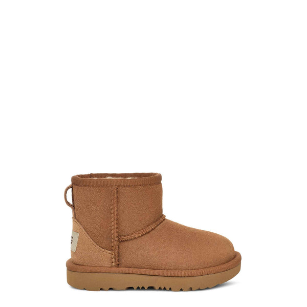 Brown children's boot on a white background