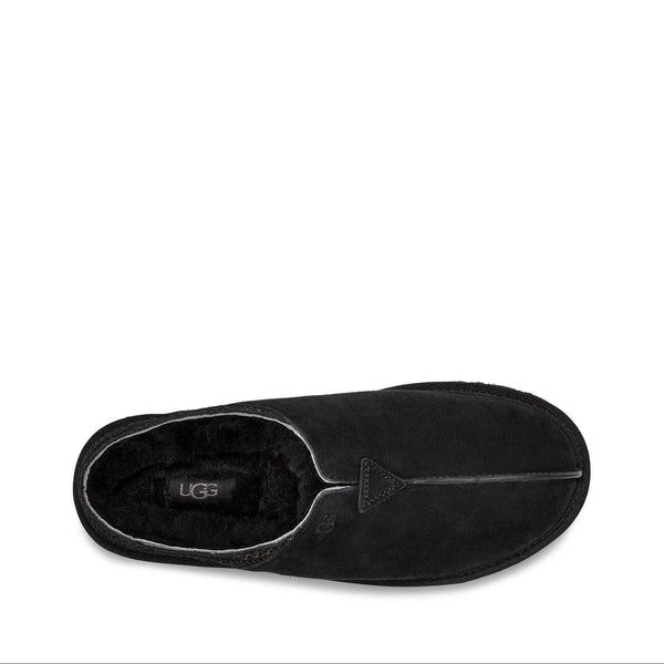 Black UGG slipper on a white background