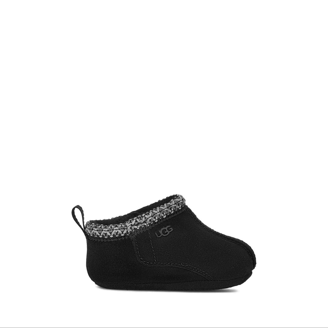 Black baby bootie with patterned trim on a white background