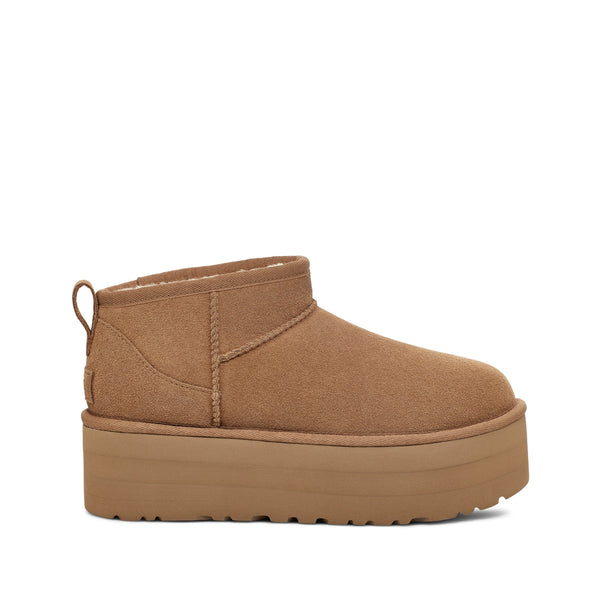 Tan ankle boot with a platform sole on a white background.