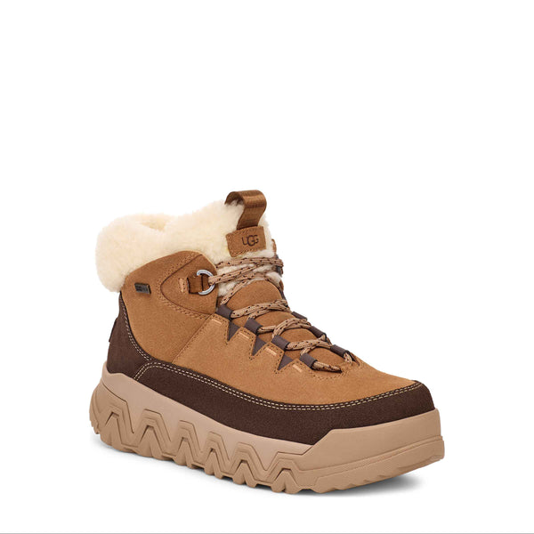 Brown winter boot with white fur lining on a white background