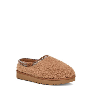 Brown slipper with fuzzy texture on a white background