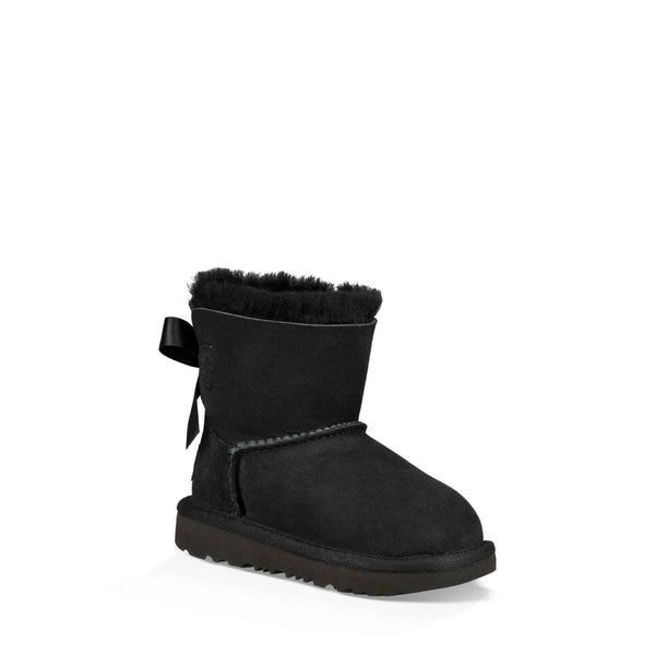 Black boot with bow detail on a white background