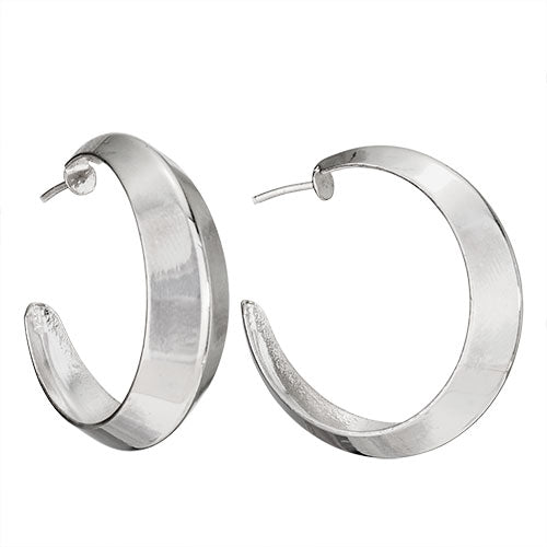 A pair of silver hoop earrings against a white background.